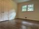 Bright bedroom with hardwood floors and ample closet space at 2023 Lee Dr, Austell, GA 30168