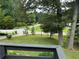 View from deck showcasing expansive backyard and quiet street at 2023 Lee Dr, Austell, GA 30168