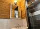 Modern bathroom with a walk-in shower and wood walls at 2023 Lee Dr, Austell, GA 30168