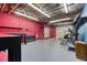 Large basement gym with mirrored walls and various exercise equipment at 3700 Tom Brewer Rd, Loganville, GA 30052