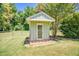 Charming storage shed with a door and wooden steps at 3700 Tom Brewer Rd, Loganville, GA 30052