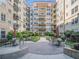 Brick courtyard with seating areas and a central fountain at 230 E Ponce De Leon Ave # 322, Decatur, GA 30030