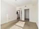Spacious bedroom with neutral walls and carpeting, and access to bathroom and closet at 230 E Ponce De Leon Ave # 322, Decatur, GA 30030