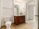Bathroom features vanity, toilet, and tiled floor at 230 E Ponce De Leon Ave # 322, Decatur, GA 30030