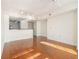 Hardwood floor living room with kitchen bar at 230 E Ponce De Leon Ave # 322, Decatur, GA 30030