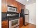 Stainless steel appliances and wood cabinets at 230 E Ponce De Leon Ave # 322, Decatur, GA 30030