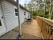 Wooden deck with table and chairs, offering peaceful wooded views at 286 Pauladean Se Cir, Marietta, GA 30067