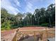 Large backyard with wooded area and partial view of a trailer at 286 Pauladean Se Cir, Marietta, GA 30067