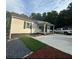 Ranch home with a covered porch and a gravel driveway at 286 Pauladean Se Cir, Marietta, GA 30067