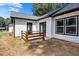 Small wooden deck adjacent to the back of the house at 2000 Grove Ave, East Point, GA 30344