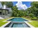 Modern rectangular pool with integrated spa and surrounding lawn at 1235 Mount Paran Nw Rd, Atlanta, GA 30327