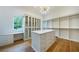 Spacious walk-in closet with island, custom cabinetry, and natural light at 1235 Mount Paran Nw Rd, Atlanta, GA 30327