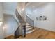 Modern staircase with wood steps and black metal railing at 1235 Mount Paran Nw Rd, Atlanta, GA 30327