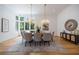 Elegant dining room with hardwood floors, a large table, and crystal chandeliers at 1235 Mount Paran Nw Rd, Atlanta, GA 30327