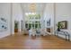 Spacious living room with hardwood floors, high ceilings, and large windows at 1235 Mount Paran Nw Rd, Atlanta, GA 30327