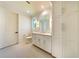 Bathroom with white cabinets, quartz countertop and large mirror at 1235 Mount Paran Nw Rd, Atlanta, GA 30327