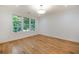 Well-lit bedroom with hardwood floors and a large window at 1235 Mount Paran Nw Rd, Atlanta, GA 30327
