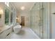 Spa-like bathroom with soaking tub, large walk-in shower, and marble flooring at 1235 Mount Paran Nw Rd, Atlanta, GA 30327