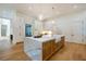 Gourmet kitchen features a large marble island, white cabinetry, and high-end appliances at 1235 Mount Paran Nw Rd, Atlanta, GA 30327