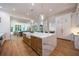 Open kitchen with large marble island and hardwood floors at 1235 Mount Paran Nw Rd, Atlanta, GA 30327