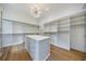 Large walk-in closet with ample shelving, drawers, and natural light at 1235 Mount Paran Nw Rd, Atlanta, GA 30327