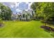 Expansive grassy yard with a modern home in the background at 1235 Mount Paran Nw Rd, Atlanta, GA 30327