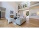 Spacious living room featuring hardwood floors, a modern fireplace, and a double-height ceiling at 1235 Mount Paran Nw Rd, Atlanta, GA 30327
