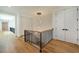 Elegant hallway with hardwood floors and a modern light fixture at 1235 Mount Paran Nw Rd, Atlanta, GA 30327