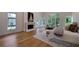 Bright main bedroom with hardwood floors, fireplace, and large windows offering backyard views at 1235 Mount Paran Nw Rd, Atlanta, GA 30327