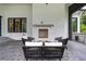 Cozy outdoor patio with fireplace and seating area at 1235 Mount Paran Nw Rd, Atlanta, GA 30327