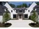 White brick home with a grand entrance and landscaping at 1235 Mount Paran Nw Rd, Atlanta, GA 30327