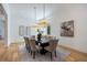 Elegant dining room with hardwood floors, a large table, and crystal chandeliers at 1235 Mount Paran Nw Rd, Atlanta, GA 30327