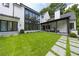 Large backyard with patio, lawn and pool; modern home exterior at 1235 Mount Paran Nw Rd, Atlanta, GA 30327