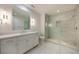 Modern bathroom with quartz vanity, large mirror, and a walk-in shower at 1235 Mount Paran Nw Rd, Atlanta, GA 30327