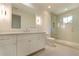 Bright bathroom with white cabinets, a large mirror, and a glass shower at 1235 Mount Paran Nw Rd, Atlanta, GA 30327