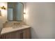 Elegant powder room with a modern vanity and unique light fixtures at 1235 Mount Paran Nw Rd, Atlanta, GA 30327