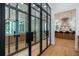 Elegant wine cellar with glass doors and built-in racking at 1235 Mount Paran Nw Rd, Atlanta, GA 30327