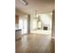 Kitchen with view into Gathering room, wood cabinets, and vinyl flooring at 2222 Baker Carter Dr, Loganville, GA 30052