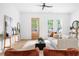 Light and airy living room with comfy seating and large windows at 597 Federal Se Ter, Atlanta, GA 30315