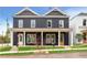 Two-story duplex with dark siding, covered porches, and well-manicured lawns at 597 Federal Se Ter, Atlanta, GA 30315