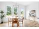 Bright dining room with light hardwood floors and a round wooden table at 597 Federal Se Ter, Atlanta, GA 30315