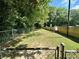 Fenced-in dog park with grassy area and waste disposal at 1501 Clairmont Rd # 1917, Decatur, GA 30033