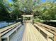 Community grilling area with long wooden benches and pergola at 1501 Clairmont Rd # 1917, Decatur, GA 30033