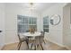 Bright dining area with a round table and four gray velvet chairs at 4254 River Green Nw Dr # 616, Atlanta, GA 30327