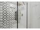 Elegant shower with patterned tile and glass enclosure at 4254 River Green Nw Dr # 616, Atlanta, GA 30327