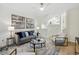 Bright living room with gray sofa and glass coffee table at 4254 River Green Nw Dr # 616, Atlanta, GA 30327