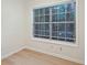 Simple office space with large window and light wood floors at 4254 River Green Nw Dr # 616, Atlanta, GA 30327