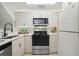 Modern kitchen featuring stainless steel appliances and white cabinets at 4254 River Green Nw Dr # 616, Atlanta, GA 30327