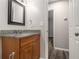 Bathroom with granite countertop vanity and mirror at 3599 Woodbriar Cir # E, Tucker, GA 30084