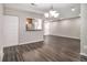 Dining area with hardwood floors and kitchen pass-through at 3599 Woodbriar Cir # E, Tucker, GA 30084